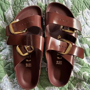 Never worn shiny brown big buckle Birkenstocks